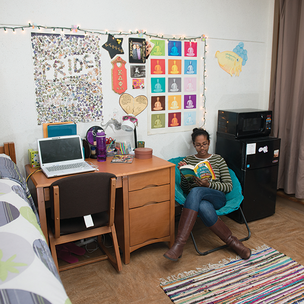 student reading in their dorm